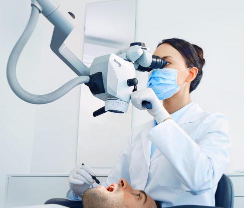 Treatment under a microscope